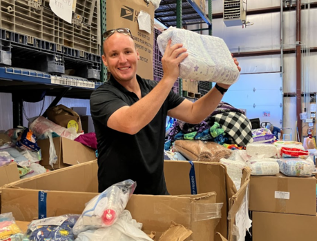 Sorting baby supply donations for refugees at Helping Hands International.