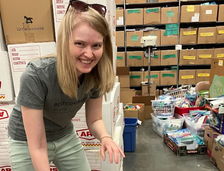 Sorting donations for refugees at Helping Hands International.