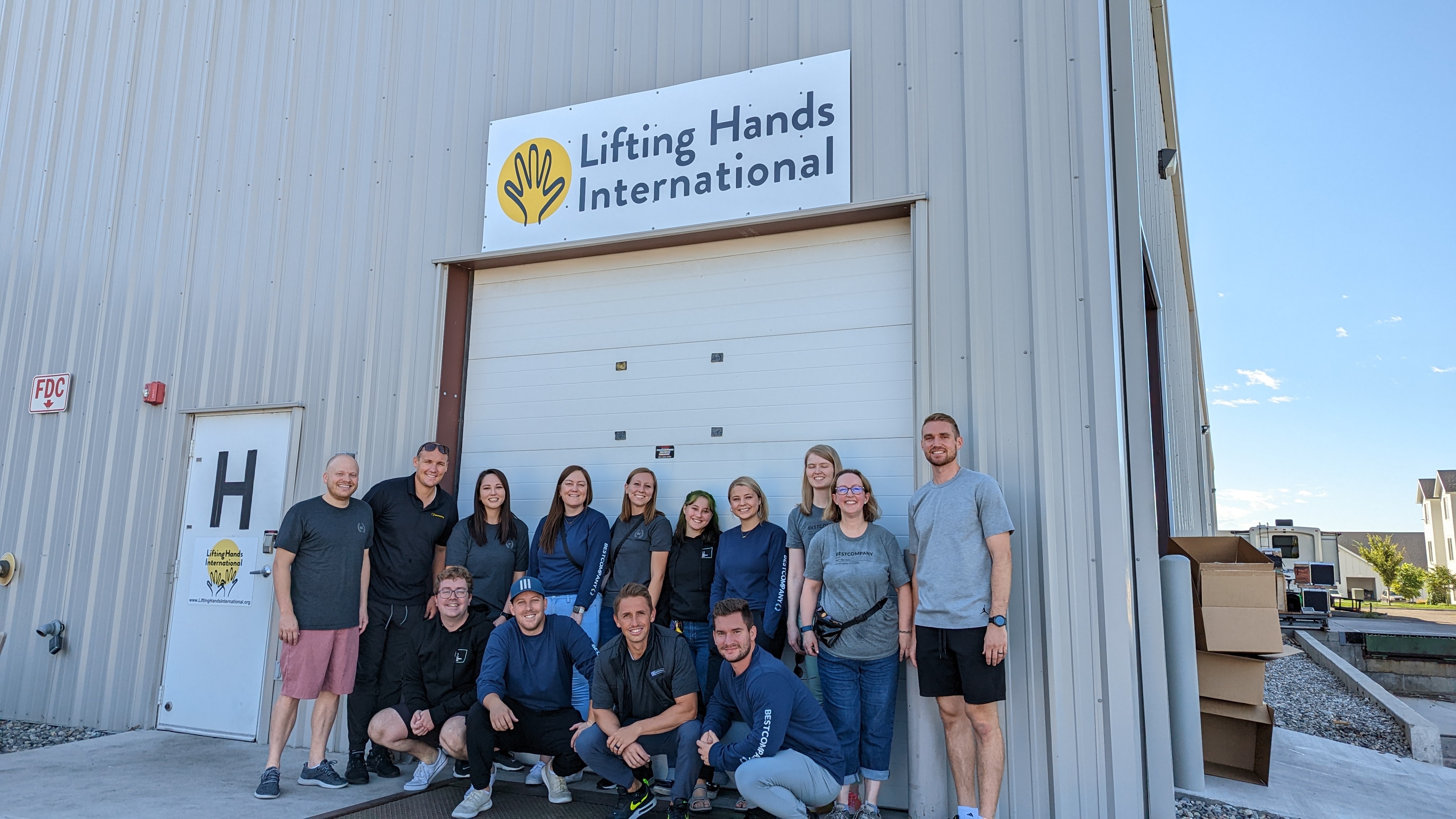 Helping sort and package supplies for refugees at Lifting Hands International.