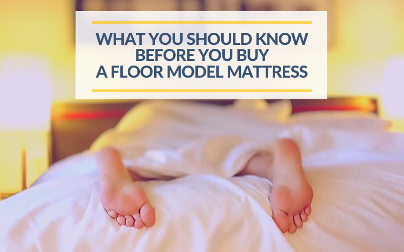 Person sleeps on a mattress with feet hanging off