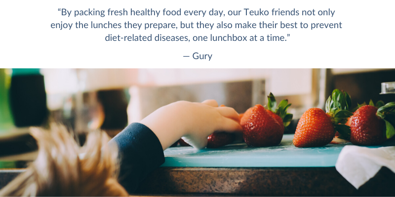 image of kid grabbing strawberries off of the counter with a quote about packing lunches for kids