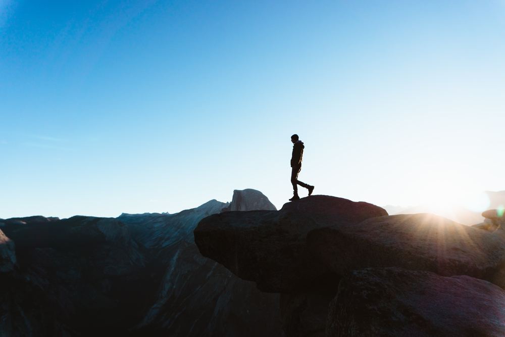 man on top of a mountain