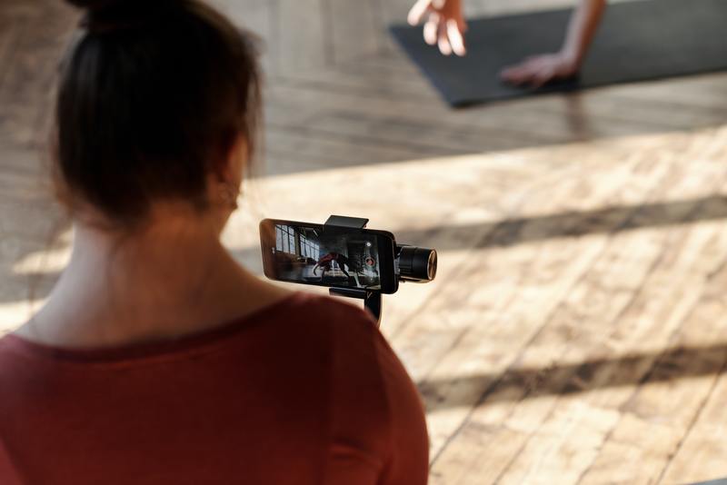 Woman recording exercise class