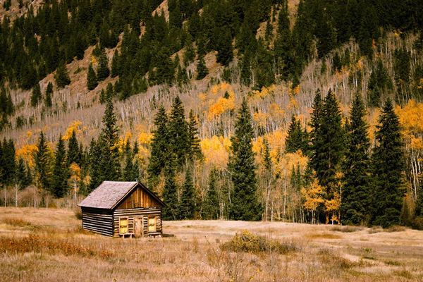 Cabin on mountain in the fall season