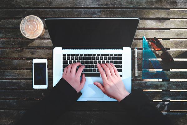 Person typing on laptop