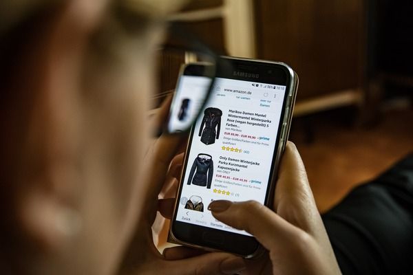 person shopping online with smart phone