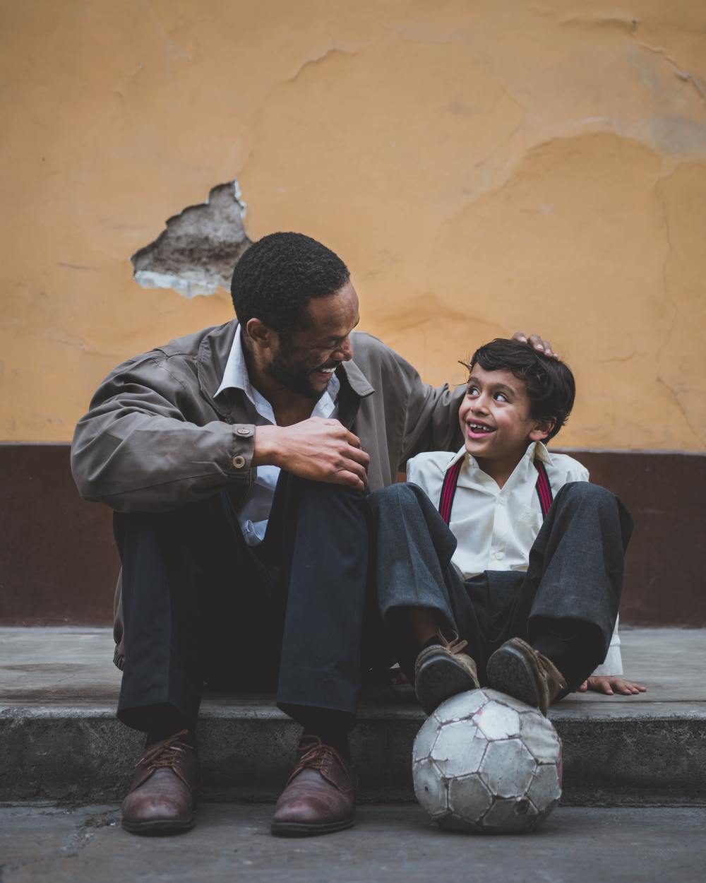 Man with son and soccer ball