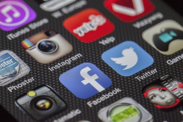 Closeup of apple interface, displaying Phoster, Instagram, Yelp, Facebook, and Twitter apps.