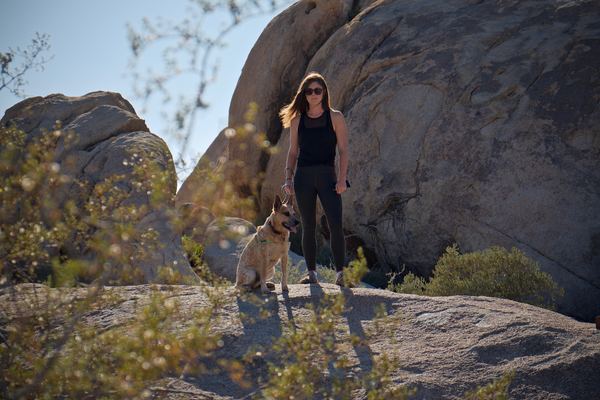 Woman hiking with dog
